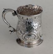 A George II 1/2 pint silver mug with C-scroll handle on a stepped base