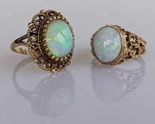 Two yellow gold oval opal dress rings with pierced decoration, sizes, both hallmarked 9ct, 11.6g