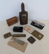 A WW2 D.B. Ltd L.E. No. 4 battery operated torch with two filters, in working order; WW2 brass gun o