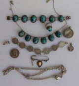 An Egyptian silver necklace with scarab adornments, matching bracelet and ring