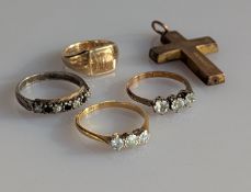 A three-stone diamond ring on a yellow gold claw setting, each diamond 0.10 carats, stamped 18ct