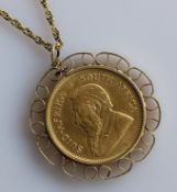 A mounted Krugerrand 1oz fine gold coin 1978, mount hallmarked 9ct, chain unmarked, but test for 9ct