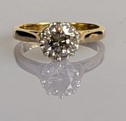 A solitaire diamond ring on an 18ct yellow gold setting, the round brilliant-cut diamond measuring a