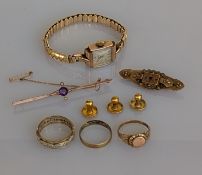 A white and yellow gold gem-set eternity ring, a gold band, a signet ring, three gold shirt buttons,