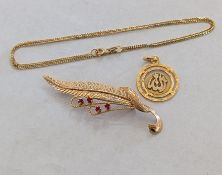 An Italian yellow gold fern brooch with ruby decoration, stamped 750 for Unoaerre and a Mid-Eastern 