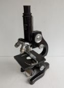 A mid-20th century mahogany-cased compound microscope by Ernst Leitz Wetzlar, Germany, black lacquer