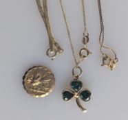 A gold shamrock pendant chain with emerald decoration, a gold St. Christopher's medal, 16mm diameter