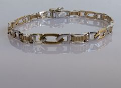 A vintage white and yellow gold fancy-link bracelet with textured decoration, hallmarked 9ct, 20 cm