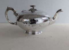 A Victorian silver teapot of melon form, etched decoration, applied floral finial, initialled to car