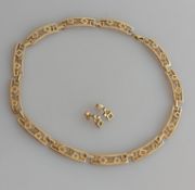 A mid-century 9ct yellow gold pierced necklace, panel-link with lobster clasp and similar earrings