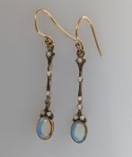 A pair of Edwardian opal and seed pearl earrings on a yellow gold setting, unmarked, opals 7 x 5mm, 