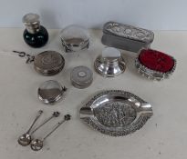 A selection of silver bibelots to include scent bottle, capstan inkwell, ring boxes pin cushion, spo