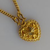 A Chinese fine yellow gold heart-shape pendant chain with elaborately etched decoration