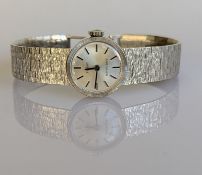 A ladies vintage 9ct gold Tissot Stylist manual-wind wristwatch with tapering textured bracelet 