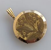 A yellow gold pendant locket with etched decoration, 26mm diameter, hallmarked 9ct, 7.9g