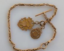 A George V rose gold fancy-link Albert watch chain with lobster clasp, T-bar and two medals attached