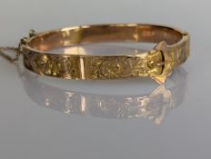 A George V yellow gold buckle bangle with etched decoration, 55mm, hallmarked 1918 for Chester, 9.2g