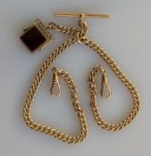 An Edwardian rose gold Albert curb-link chain with double lobster clasps, T-bar and fob swivel