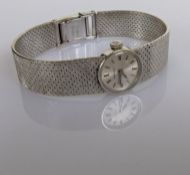 A vintage Marvin ladies manual wristwatch with integrated white gold case and textured strap and dep