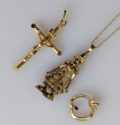 A gold articulated clown pendant, 42mm, with gem-set decoration and chain; a crucifix pendant