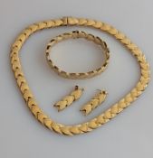 A 9ct yellow gold parure comprising necklace, bracelet and earrings with chevron pattern, hallmarked