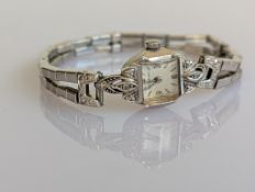 An Art Deco Wittnauer ladies manual cocktail watch with Arabic numerals and a 14ct white gold case