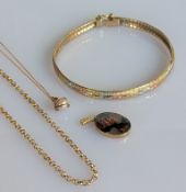 An Italian tri-gold bracelet, 18.5 cm; a yellow gold belcher chain, 44 cm; a yellow gold oval