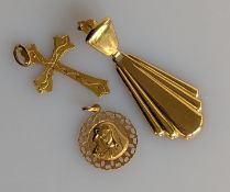A yellow gold pierced disc pendant, an etched crucifix and a single drop earring, all hallmarked 750