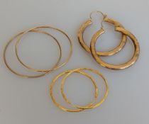 A pair of yellow gold hoop earrings with etched decoration, stamped 916, 2.13g, and another larger p