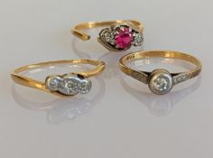 Two Art Deco diamond-set rings, one illusion-set and a three-stone diamond and ruby ring, cut