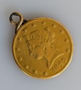 An 1849 Liberty Head ten dollar gold coin with reeded edge fitted as a pendant, 16.6g, 27mm