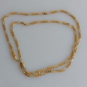 A yellow gold figaro neck chain