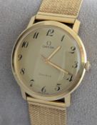 A late 1960s Omega Geneve manual wristwatch with Arabic numerals, sweeping seconds hand, gold case