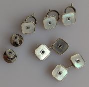 A matching set of square white gold and mother-of-pearl cufflinks and shirt buttons with sapphire