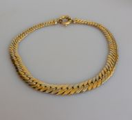 An Italian white and yellow gold tapering necklace with bolt ring clasp, 43.5 cm, hallmarked 750, 60