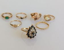 A sapphire and diamond cluster ring on a yellow gold claw setting, stamped 14k, 4.6g s