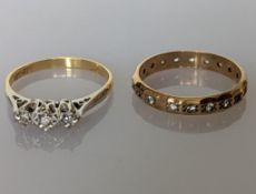 A three-stone diamond ring in a platinum illusion setting, each diamond approximately 0.05 carats on