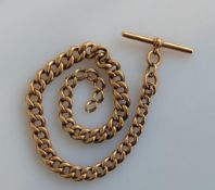 A yellow gold graduated curb-link watch chain with T-bar, each link stamped 375, 32 cm, 53.7g