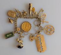 A yellow gold flat curb-link bracelet with sixteen charms, all hallmarked 9ct, with a mounted Victor