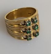 A yellow gold and emerald ring with tapering shank, stamped 585, size N, cut, 8.4g
