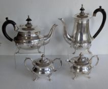 A four piece silver-plated tea and coffee service and a two branch silver plate candelabra (2)