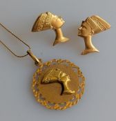 A yellow gold pendant disc neck chain with mounted cameo featuring Nefertiti, hallmarked 18ct and a