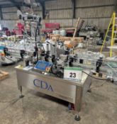 A CDA Ninon 1500 Bottle Labelling Machine with Triple Label Application, Front, Back and Neck of