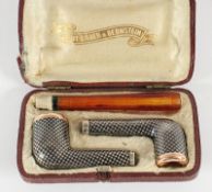 zwei Pfeifenköpfe und eine -spitze, Silber 800/ooo, Niello, Etui, Österreich, A.20.Jh., Grillo