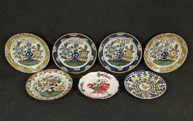 sieben Teller, Fayence, meist Delft, besch.,