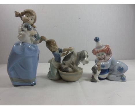 2 Nao figures both of girls with dogs and a Lladro figure of a clown with a dog