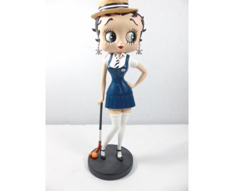 Betty Boop as a school girl with a hockey stick approx. 12.5"