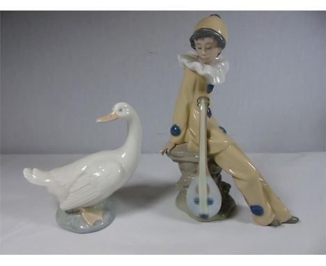 Nao duck, clown together with a Spanish figure of a girl with sheep and lamp