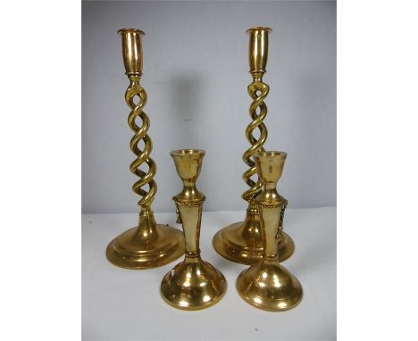 Pair of brass candlesticks with twisted stem approx. 12" Pair of brass candlesticks approx. 6.5" single brass candlestick and