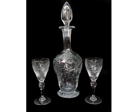 Webb - An intaglio cut decanter and stopper decorated with buttercup type flowers within leafy swags, and two glasses conform